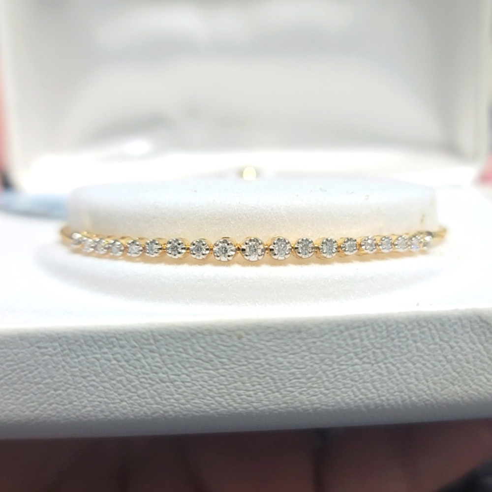 10KYG over sterling silver 1/4 CTTW diamond bracelet.